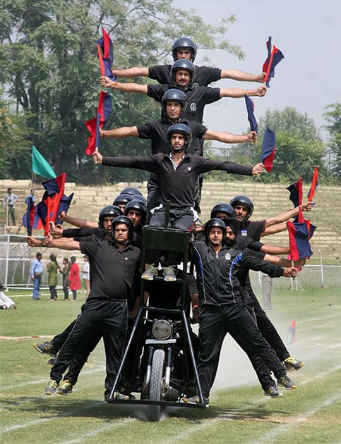 Jammu and Kashmir Police personnel performs during the full dress rehearsal of Independence Day parade at Bakhshi Stadium in Srinagar.