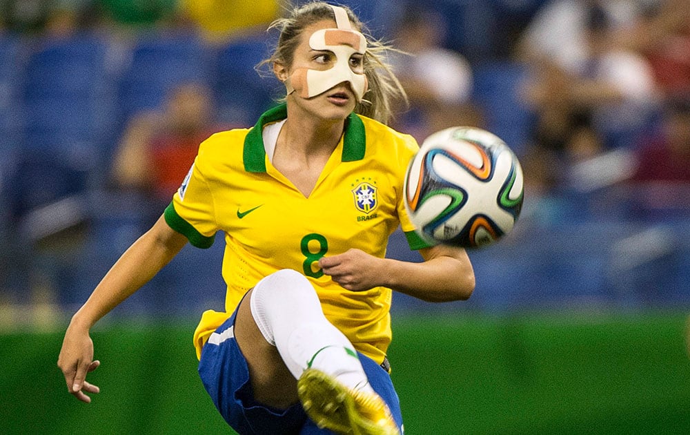 Brazil`s Djenifer plays the ball as they face Germany during first half FIFA U20 Women`s World Cup soccer action in Montreal. 