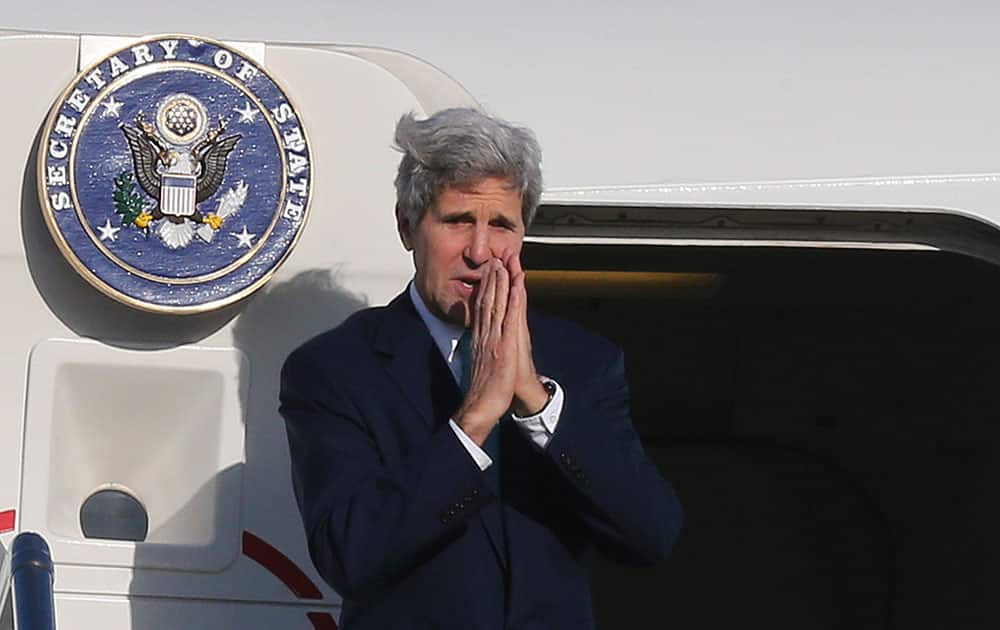 US Secretary of State John Kerry holds hands to bid farewell in Sydney, Australia.