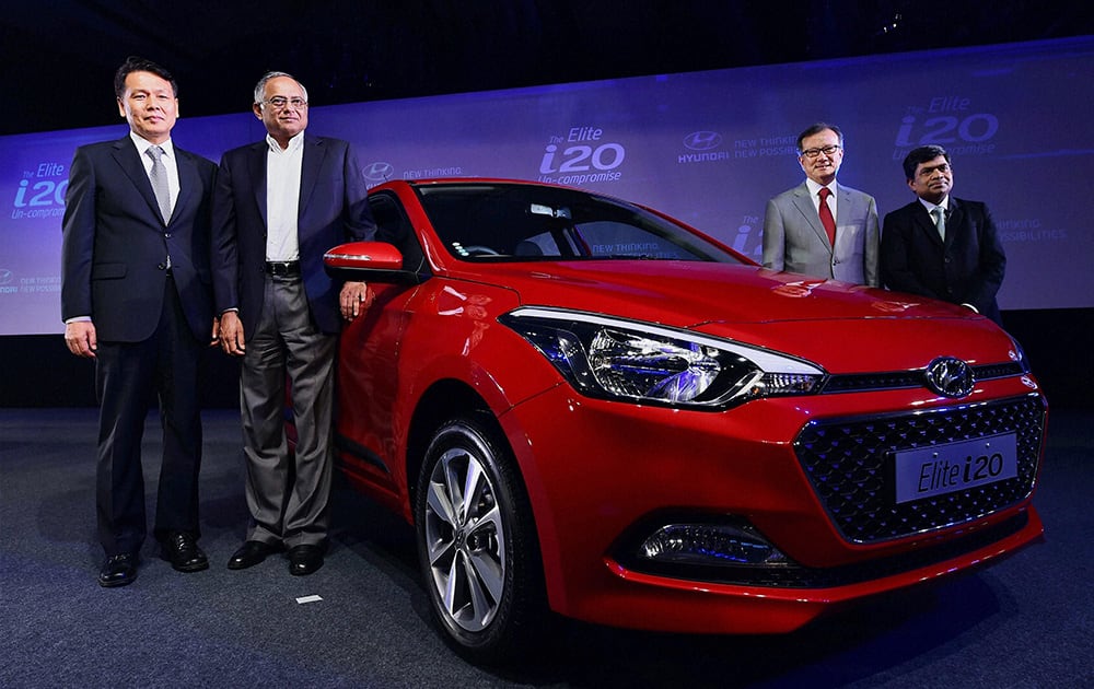 BS Seo, MD and CEO, Hyundai Motors India and Chairman of TVS Motors Venu Srinivasan (2nd from L) along with other company officials at the launch of Elite i20 car in Chennai.