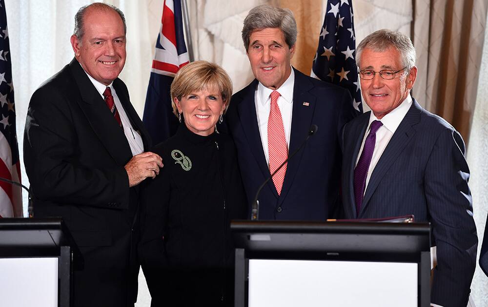 Australian Defence Minister David Johnston, Australian Foreign Minister Julie Bishop, US Secretary of State John Kerry and US Secretary of Defense Chuck Hagel pose for a photograph after a press conference at the conclusion of the annual Australia-US Ministerial Consultations (AUSMIN), at Admiralty House in Sydney.