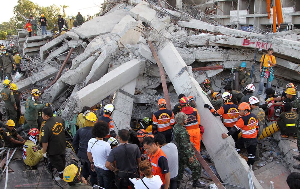 Thai rescue workers and soldiers continue their search at the site of a six-story building collapse in Pathum Thani province, just north of Bangkok, Thailand.