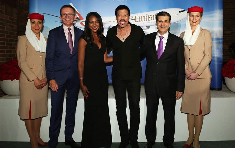 (L-R) Emirates DSVP Commercial Operations West Hubert Frach, TV Personality Brittney Payton, music icon Lionel Richie and EVP & COO Adel Al Redha celebrate the Emirates route launch at historic Navy Pier in Chicago, Ill. 