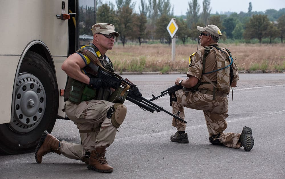 Ukrainian government soldiers from battalion `Donbass` guard at a checkpoint positions in village Mariinka near Donetsk, eastern Ukraine.