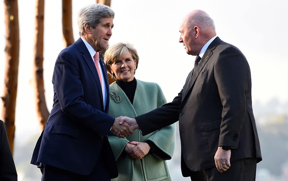 US Secretary of State John Kerry, left, and Australian Foreign Minister Julie Bishop, center, are greeted by Governor-General Peter Cosgrove at Admiralty House in Sydney.