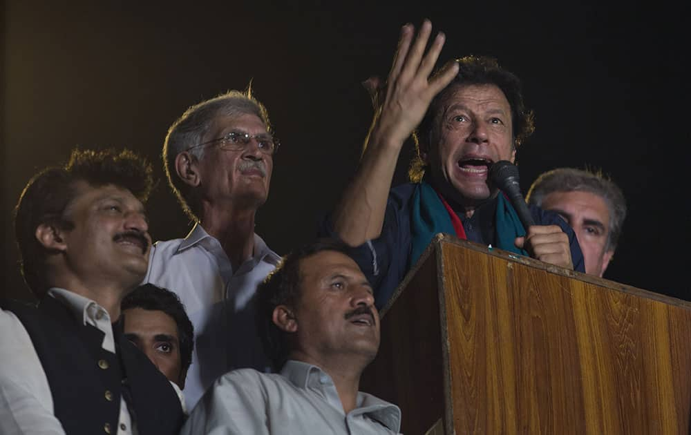 Pakistan`s cricketer-turned-politician Imran Khan motivates his supporters to march to Parliament House in Islamabad, Pakistan.