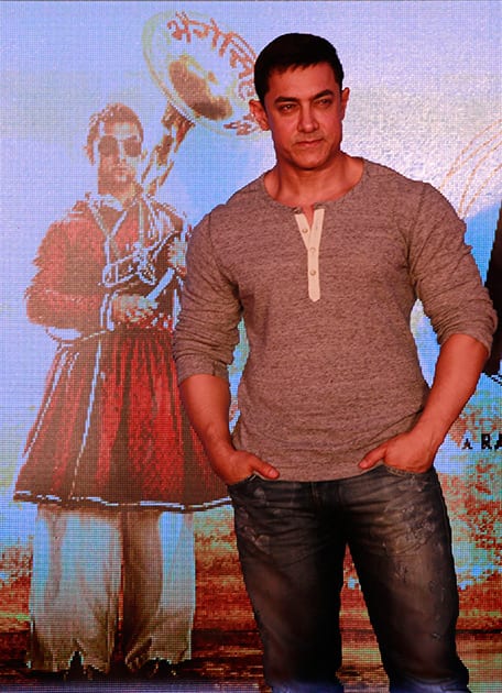 Aamir Khan poses during the unveiling of the second poster of his upcoming film PK in Mumbai.