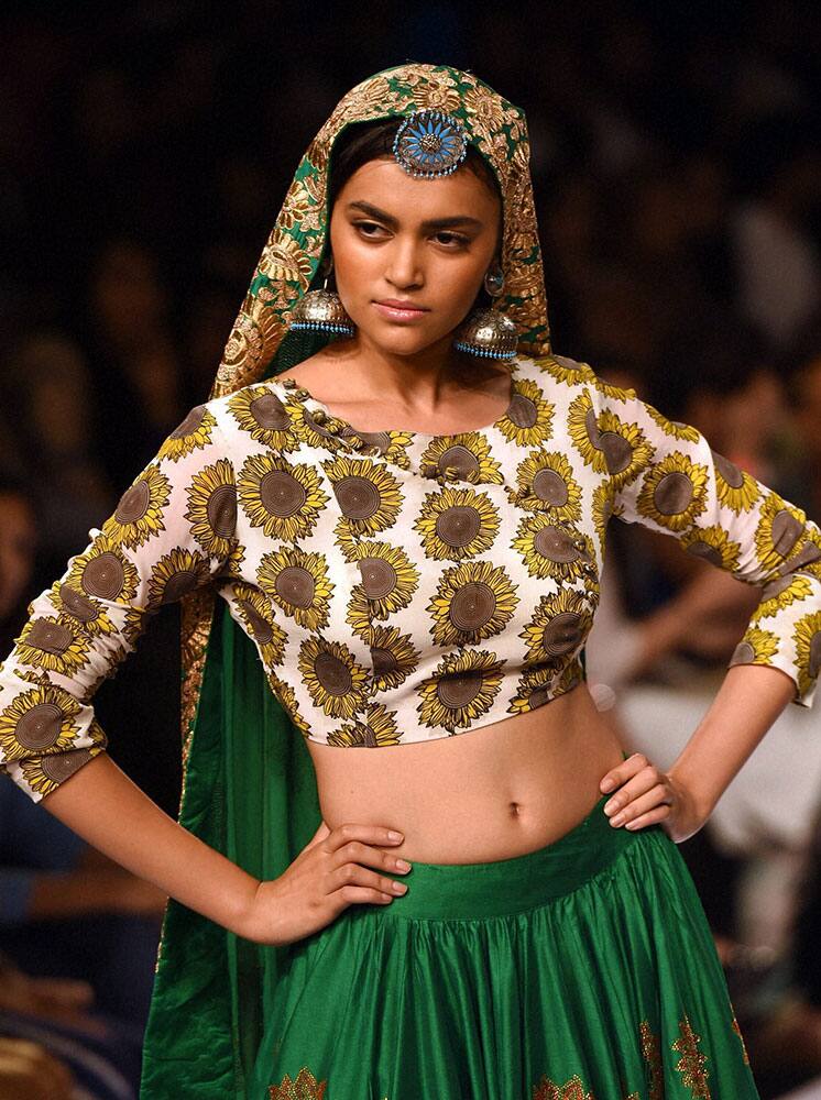 A model walks the ramp at Lakme Fashion Week Winter/Festive 2014 in Mumbai.