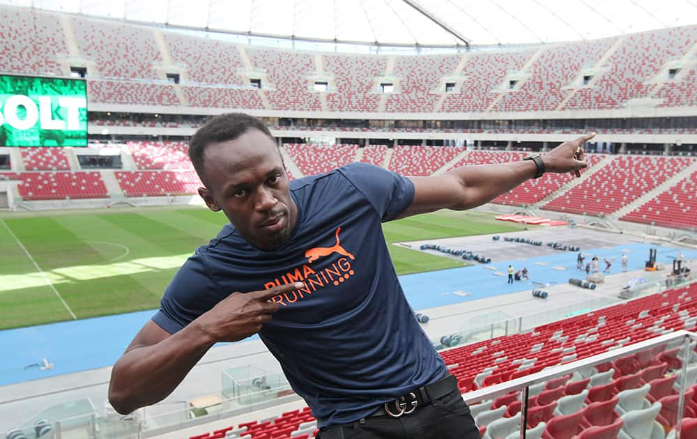 Jamaican sprinter Usain Bolt poses for photographers at the National Stadium in Warsaw, Poland.