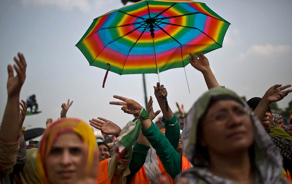 Female supporters of anti-government cleric Tahir-ul-Qadri react after his speech during a protest in front of the Parliament building, in Islamabad, Pakistan.