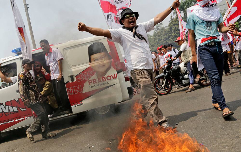 A supporter of losing presidential candidate Prabowo Subianto shouts slogans during a protest near the Constitutional Court in Jakarta, Indonesia.