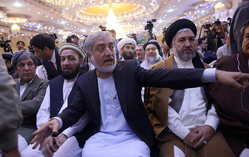 Afghan presidential candidate Abdullah Abdullah talks to his supporters during a rally at a wedding hall in Kabul, Afghanistan.