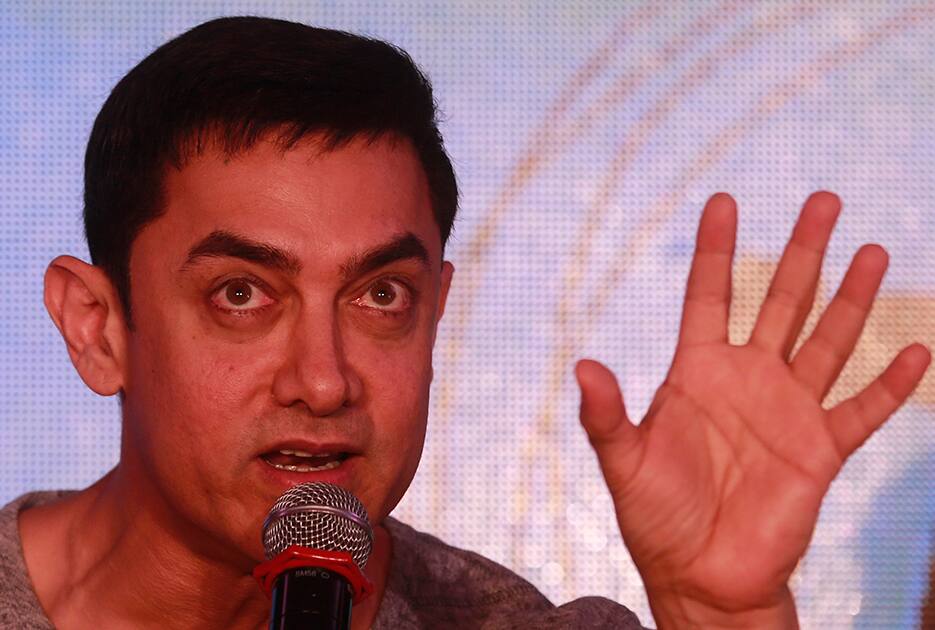 Bollywood actor Aamir Khan speaks during the unveiling of the second poster of his upcoming film PK in Mumbai.