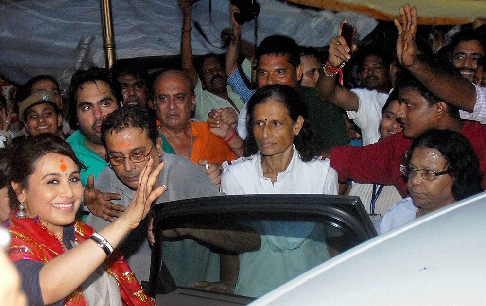 Rani Mukerji waves as she comes out after offering prayers at historic Kalighat Kali temple during promotion of her new film Mardaani.