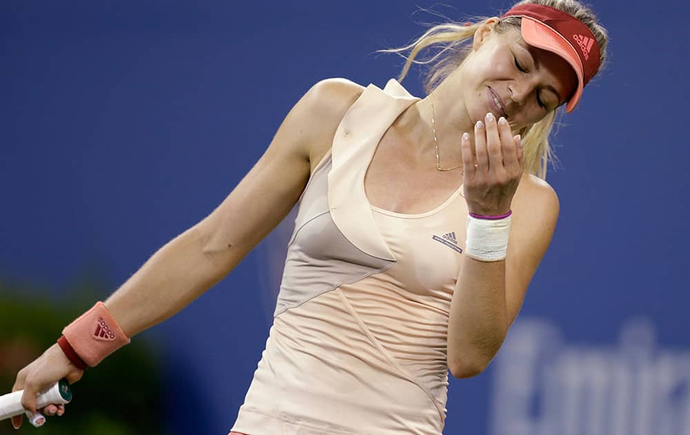 Maria Kirilenko, of Russia, reacts after missing a shot against Maria Sharapova, of Russia, during the opening round of the US Open tennis tournament.