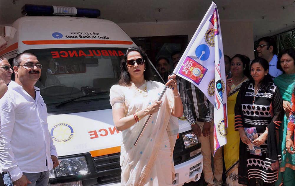 Bharatiya Janata Party MP and Bollywood actor Hema Malini flags off an ambulance donated by Rotary Club in Mathura.