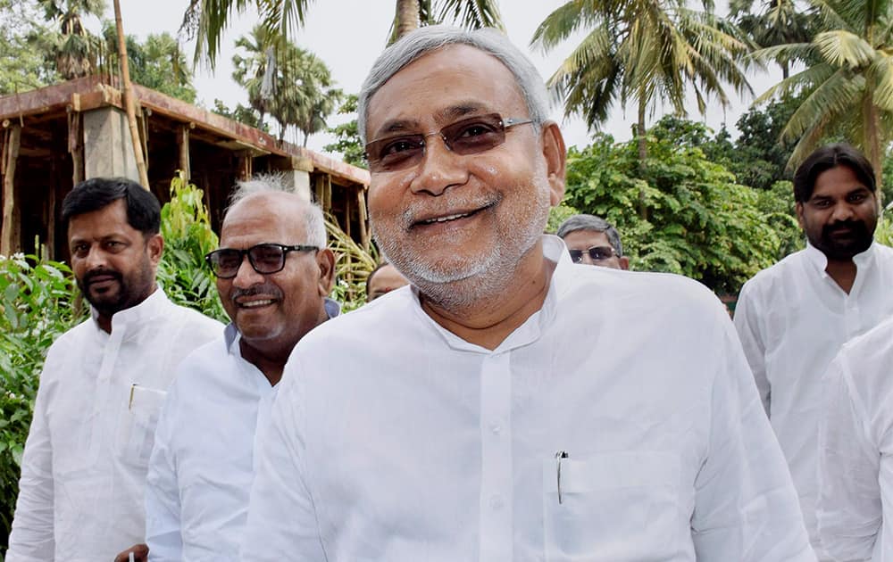 Former Bihar Chief Minister and Janata Dal (United) leader Nitish Kumar arrives for a press conference at his residence in Patna after Bihar bypoll results.