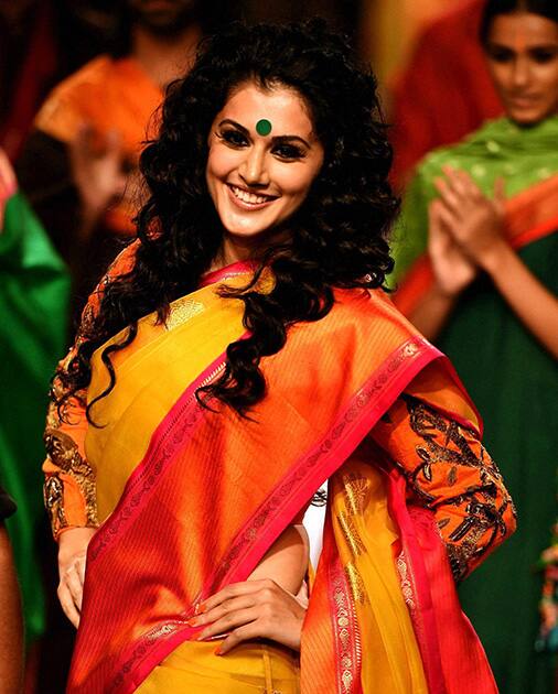 Bollywood actress Taapsee Pannu walks the ramp at the Lakme Fashion Week Winter/Festive 2014, in Mumbai.