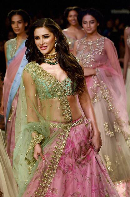 Bollywood actress Nargis Fakhri walks the ramp at Lakme Fashion Week Winter/Festive 2014 in Mumbai.