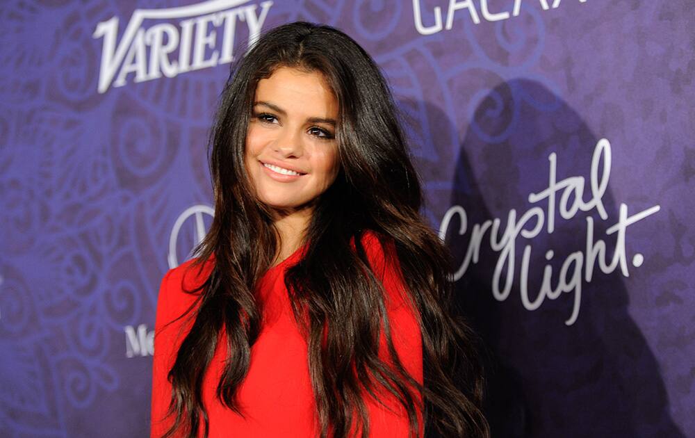 Selena Gomez arrives at Variety and Women in Film's pre-Emmy celebration at Gracias Madre, in West Hollywood, Calif.