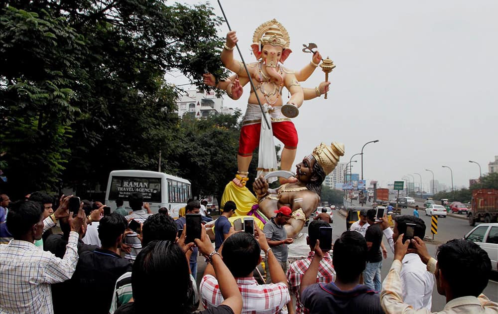 Devotees carrying idol of Lord Ganesh ahead of Ganesh festival in Thane.