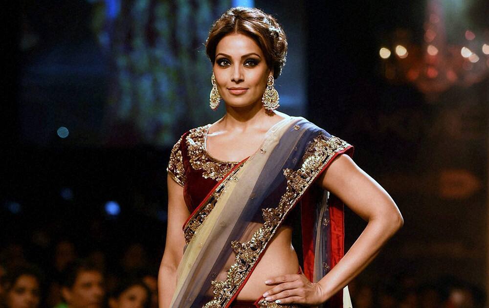 Bollywood actress Bipasha Basu walks the ramp during a fashion show displaying the collection of designer Vikram Phadnis, at the Lakme Fashion Week Winter/Festive 2014, in Mumbai.