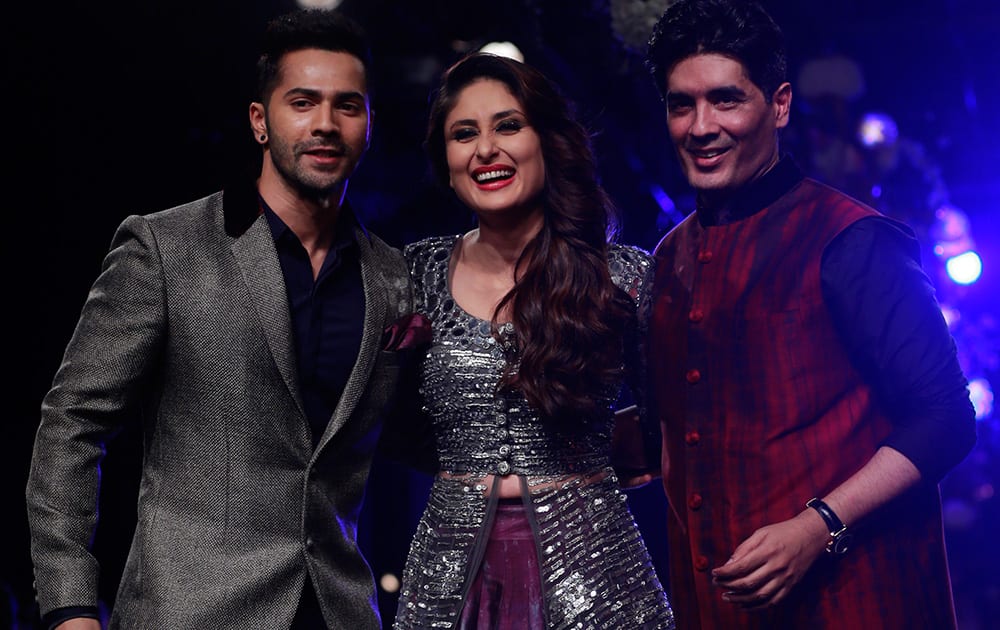 Varun Dhavan, Kareena Kapoor  along with Indian designer Manish Maholtra posses for a picture during the Lakme Fashion Week in Mumbai.