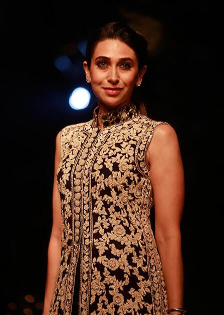 Karisma Kapoor poses for photographs on the sidelines of the Lakme Fashion Week in Mumbai.