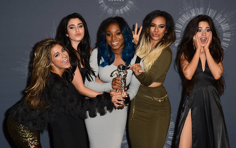 Fifth Harmony poses with the award for Artist to Watch in the press room at the MTV Video Music Awards at The Forum in Inglewood, Calif.