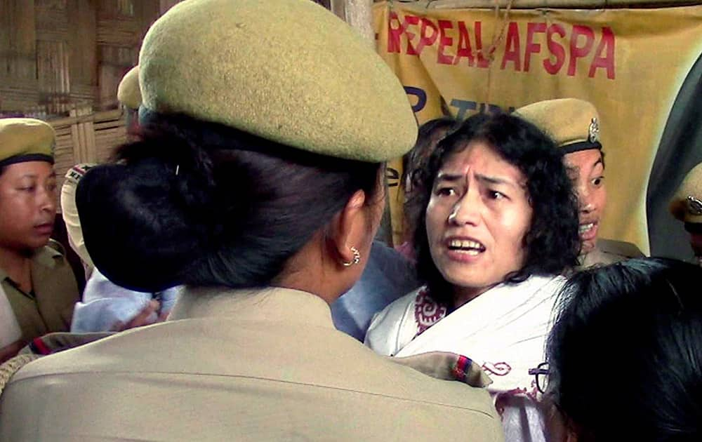 Irom Sharmila is detained by policewomen in Imphal, in the northeastern Indian state of Manipur.