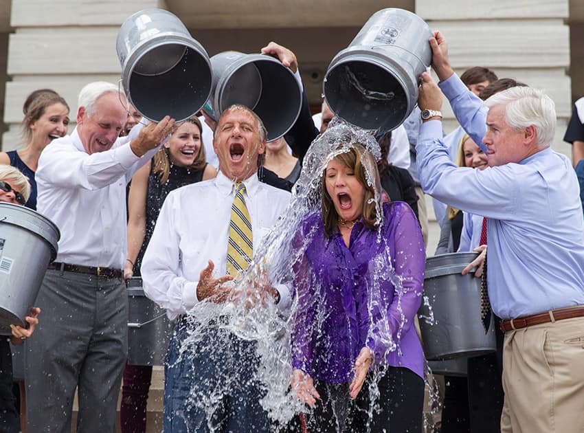 Staffers douse Tennessee Gov. Bill Haslam and his wife, Crissy, with cold water on the steps of the state Capitol in Nashville, Tenn.