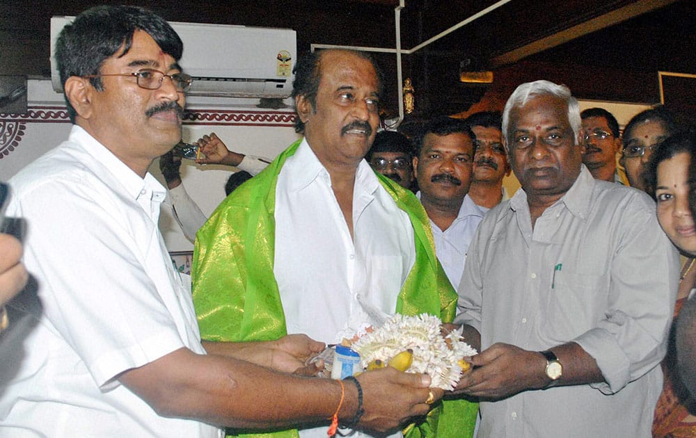 Rajinikanth being fecilitated during a visit to Kollur Mookambika Temple in Mangalore.