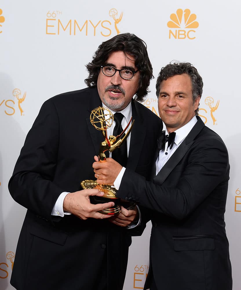 Alfred Molina, left, and Mark Ruffalo pose in the press room at the 66th Annual Primetime Emmy Awards at the Nokia Theatre L.A.