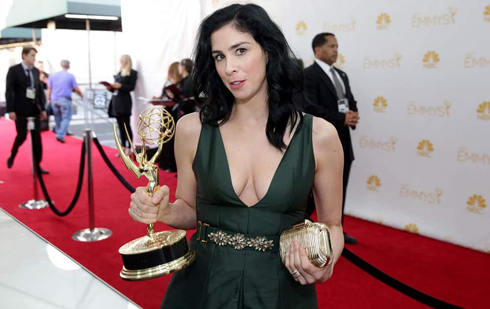 Sarah Silverman poses backstage with Emmy at the 66th Primetime Emmy Awards at the Nokia Theatre L.A.