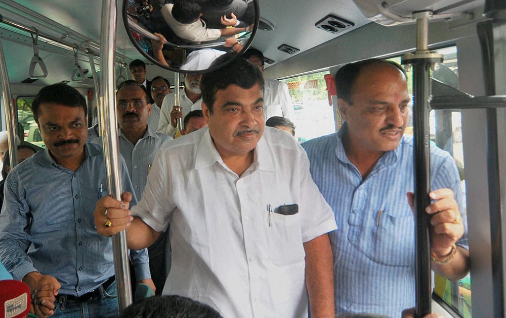 Road Transport and Highways Minister Nitin Gadkari inside an Ethanol Green bus of Sweden based Scania company after it was flagged off by him in Nagpur.