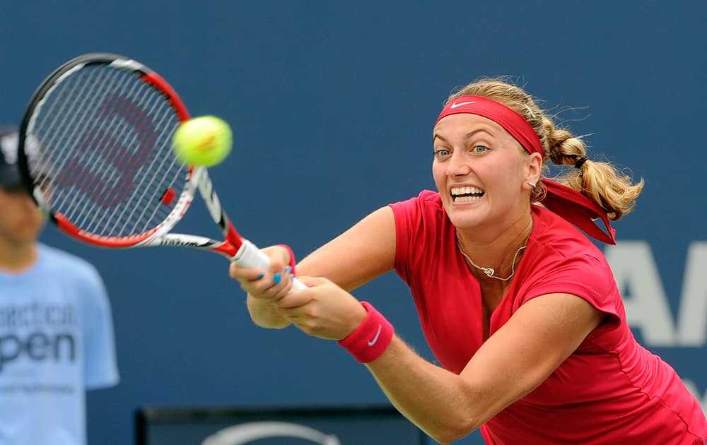 Petra Kvitova, of the Czech Republic, reaches for a backhand against compatriot Barbora Zahlavova Strycova at the New Haven Open tennis tournament in New Haven, Conn.