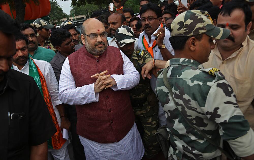 Bharatiya Janata Party (BJP) president Amit Shah, center, arrives to address party workers Hyderabad.