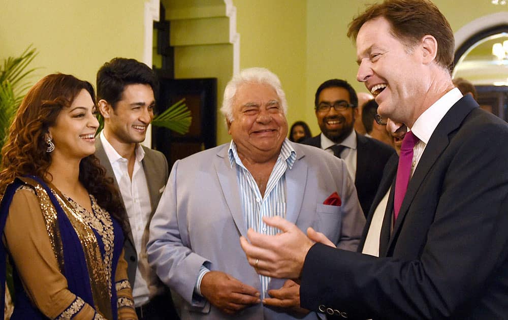 Britain's Deputy Prime Minister Nick Clegg, right, speaks with Bollywood actress Juhi Chawla, left, and former indian cricketer Farokh Engineer, second right, during a Bollywood film event in Mumbai.