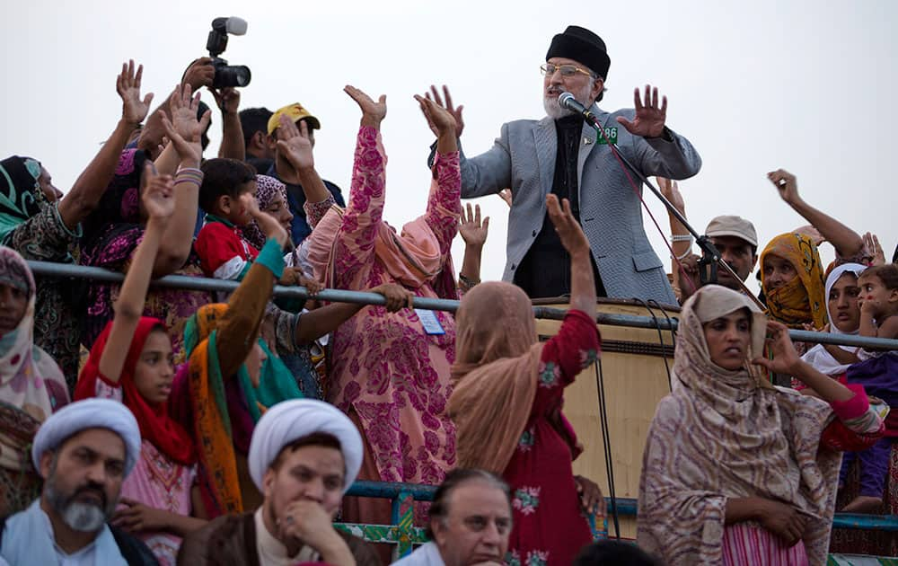 Pakistan's Muslim cleric Tahir-ul-Qadri addresses his supporters during an anti-government sit-in protest near the parliament building in Islamabad.