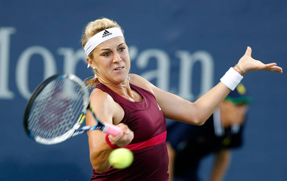 Anastasia Pavlyuchenkova, of Russia, returns a shot to Teliana Pereira, of Brazil, during the opening round of the US Open tennis tournament, in New York.