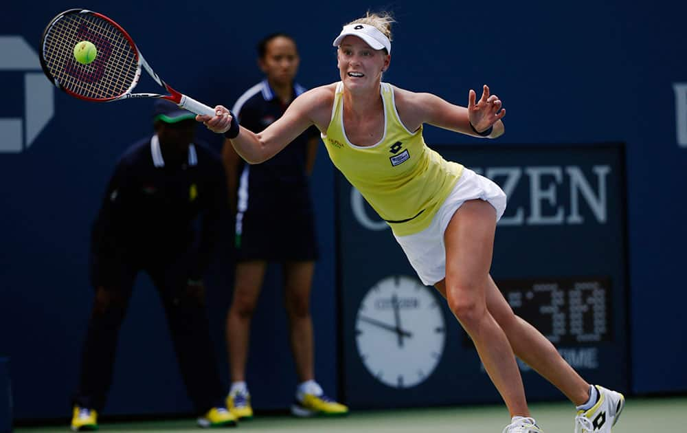 Alison Riske, of the United States, returns a shot against Ana Ivanovic, of Serbia, during the opening round of the 2014 US Open tennis tournament, in New York.