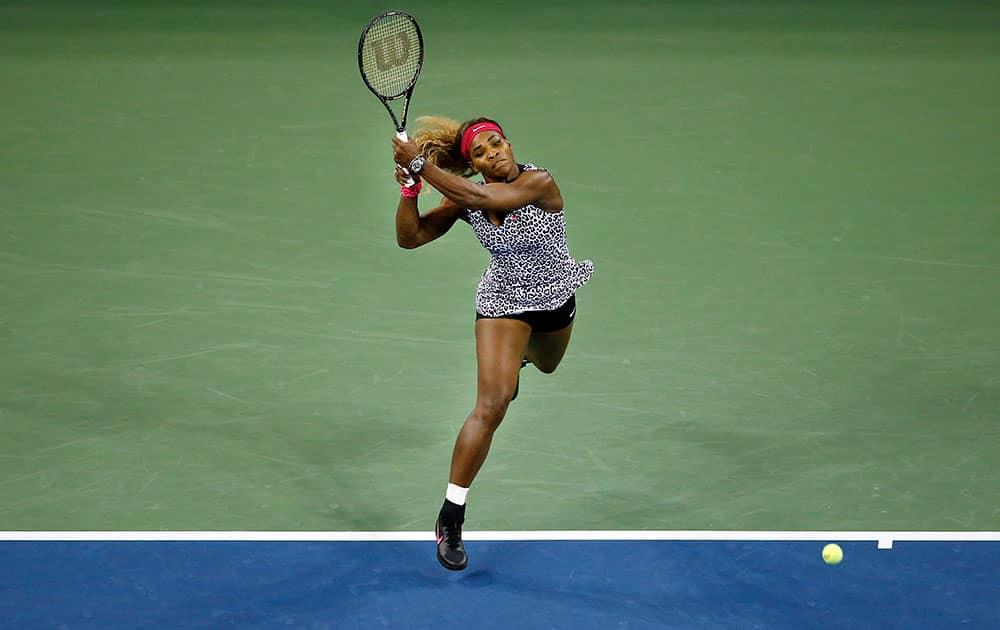 Serena Williams, of the United States, returns a shot to Taylor Townsend, of the United States, during the opening round of the US Open tennis tournament, in New York.