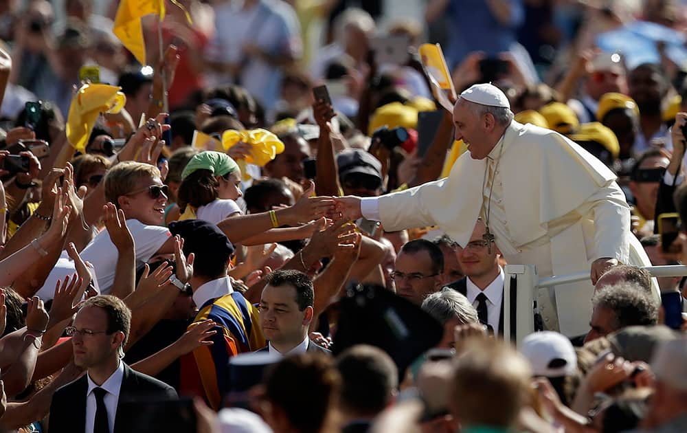 Pope Francis arrives with his popemobile in St. Peter's Square on the occasion of the weekly general audience at the Vatican.