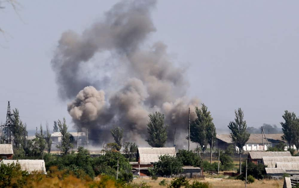 Smoke rises during shelling in the town of Novoazovsk, eastern Ukraine.