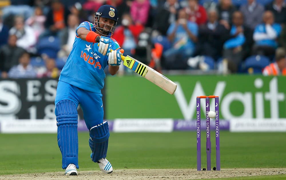 Suresh Raina hits four runs off the bowling of England's Chris Jordan during their One Day International cricket match at the SWALEC cricket ground in Cardiff, Wales.