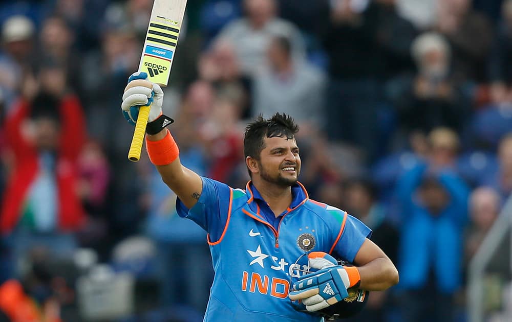 India's Suresh Raina celebrates getting 100 runs not out, during their One Day International cricket match against England at the SWALEC cricket ground in Cardiff, Wales.