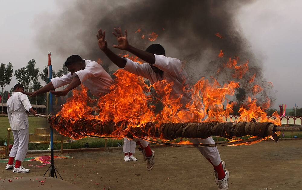 Soldiers of the Indian Central Reserve Police Force (CRPF) display their skills during a passing out parade on the outskirts of Srinagar.