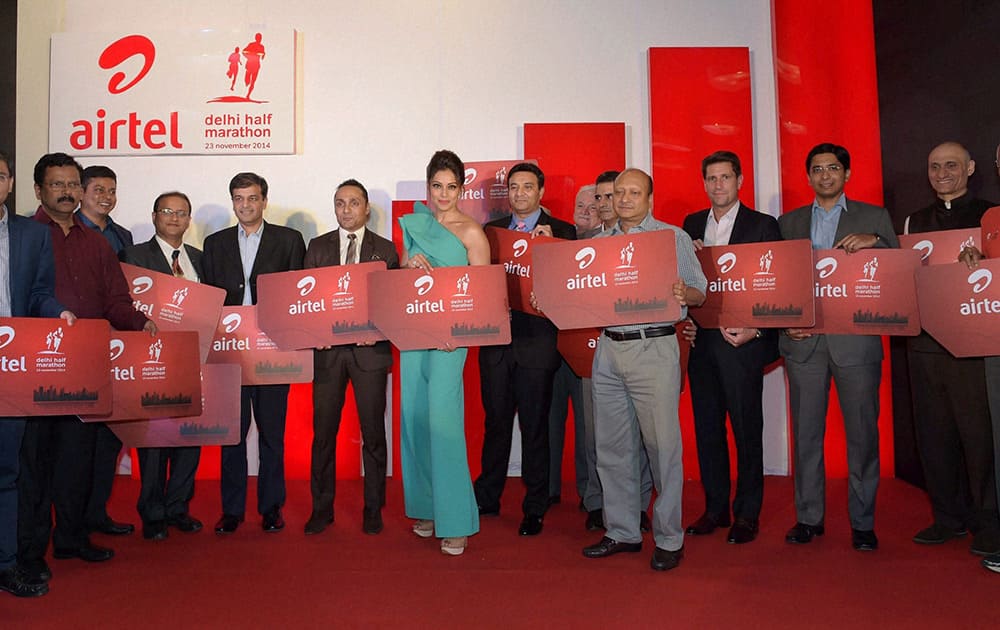 Bipasha Basu , Actor Rahul Bose, Sports Secretary Ajit Sharan and other officials launch registrations forms for the upcoming Airtel Delhi Half Marathon at a press conference, in New Delhi.