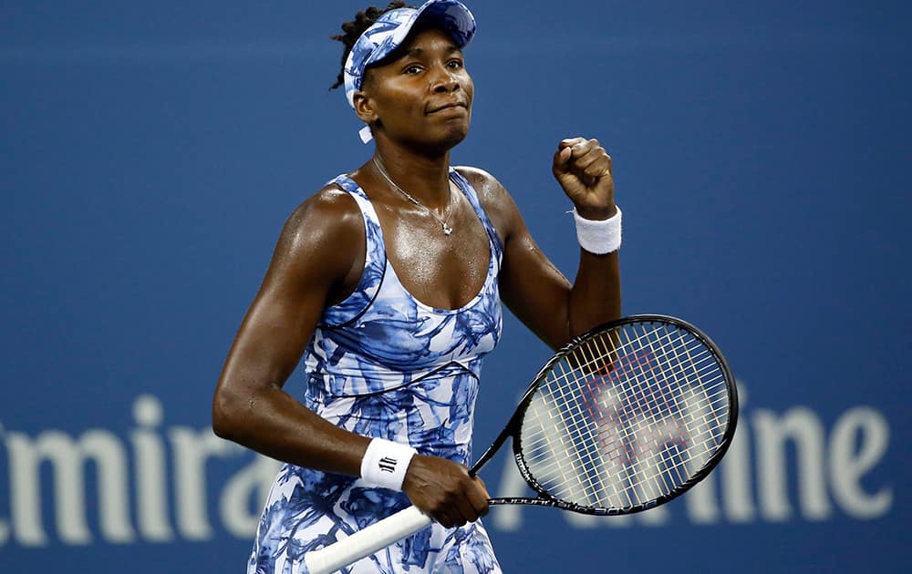 Venus Williams, of the United States, reacts after defeating Timea Bacsinszky, of Switzerland, during the second round of the U.S. Open tennis tournament in New York.