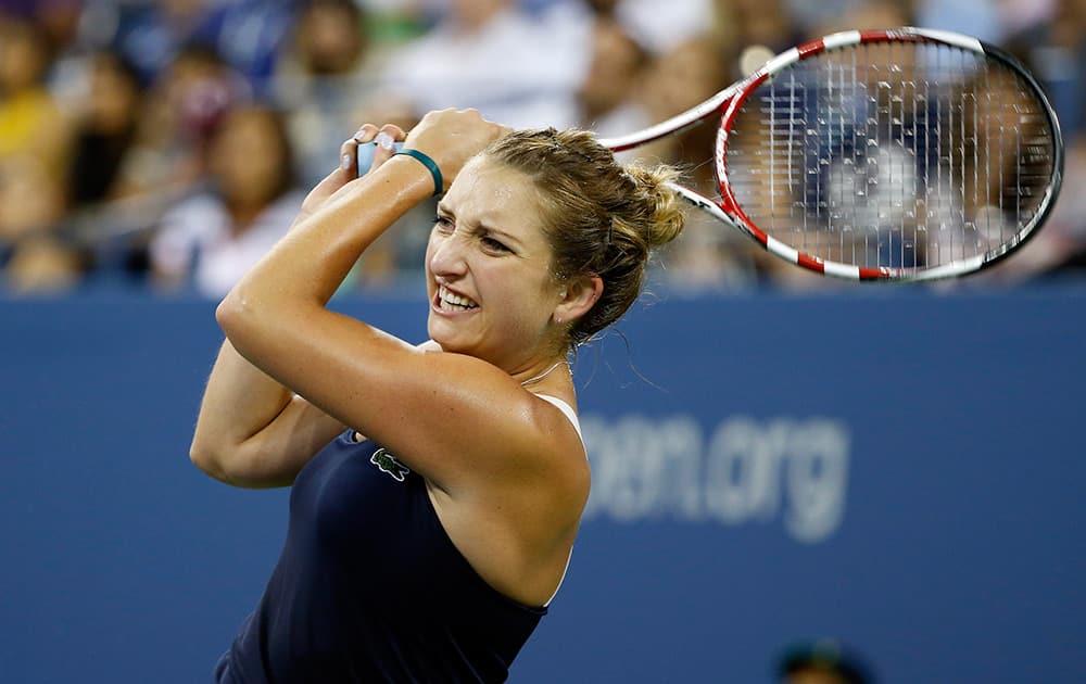 Timea Bacsinszky, of Switzerland, watches a return to Venus Williams, of the United States, during the second round of the U.S. Open tennis tournament in New York.